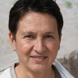 Joyful white middle-aged male with short  brown hair and brown eyes