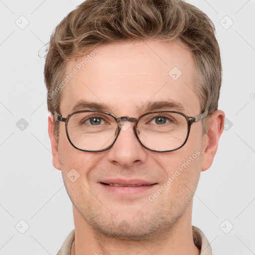 Joyful white adult male with short  brown hair and grey eyes