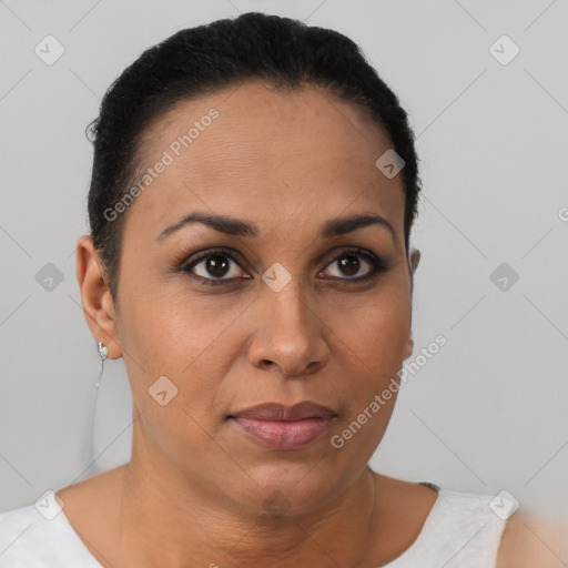 Joyful black adult female with short  brown hair and brown eyes