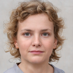 Joyful white young-adult female with medium  brown hair and blue eyes