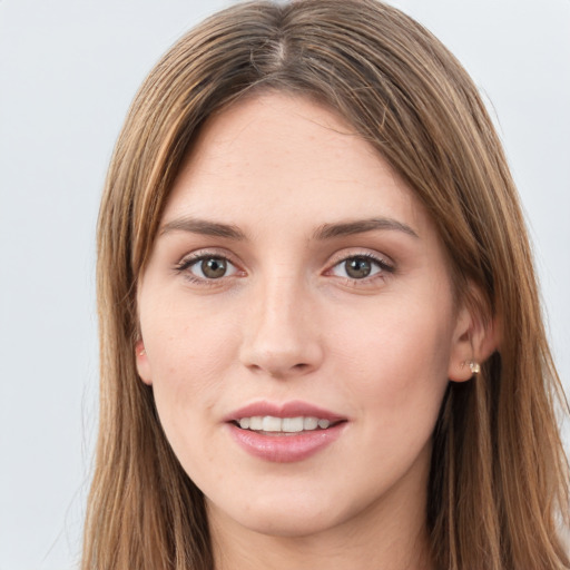 Joyful white young-adult female with long  brown hair and grey eyes