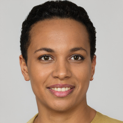 Joyful latino young-adult female with short  black hair and brown eyes