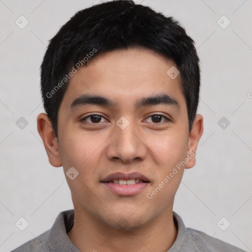 Joyful asian young-adult male with short  black hair and brown eyes