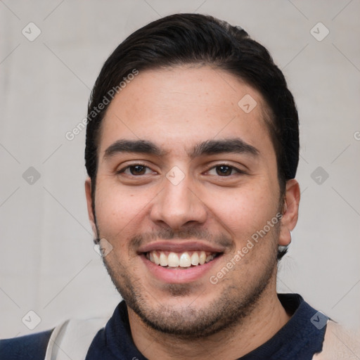 Joyful white young-adult male with short  black hair and brown eyes