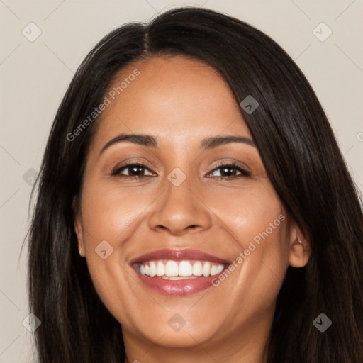 Joyful latino young-adult female with long  brown hair and brown eyes