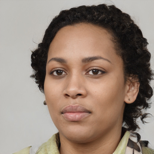 Neutral black young-adult female with medium  black hair and brown eyes