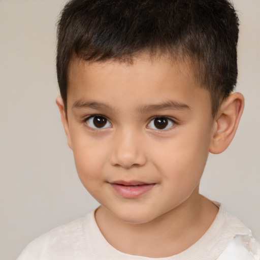 Joyful white child male with short  brown hair and brown eyes