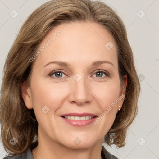 Joyful white adult female with medium  brown hair and grey eyes