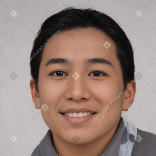 Joyful asian young-adult male with short  black hair and brown eyes