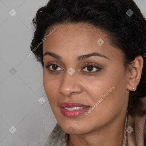 Joyful black young-adult female with long  brown hair and brown eyes