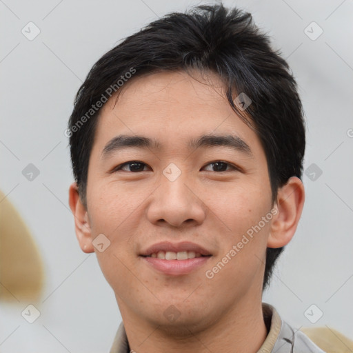 Joyful asian young-adult male with short  brown hair and brown eyes