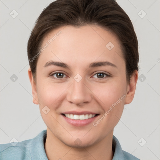 Joyful white young-adult female with short  brown hair and brown eyes