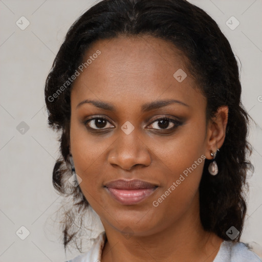 Joyful black young-adult female with medium  brown hair and brown eyes