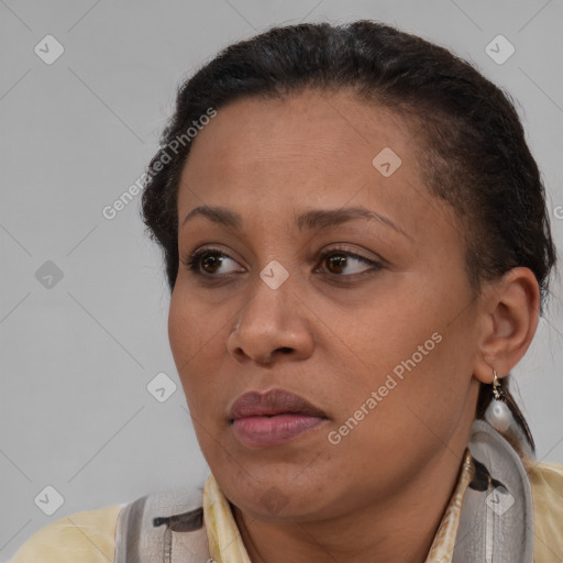 Joyful black adult female with short  brown hair and brown eyes