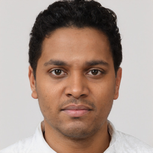 Neutral black young-adult male with short  brown hair and brown eyes