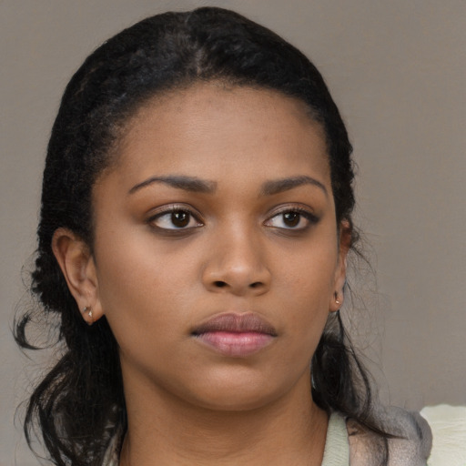 Neutral black young-adult female with medium  black hair and brown eyes