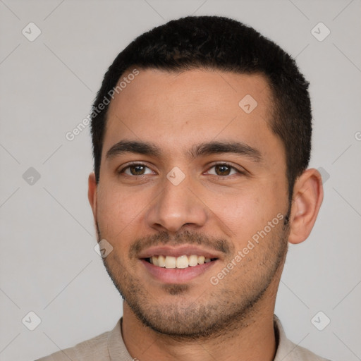 Joyful white young-adult male with short  black hair and brown eyes