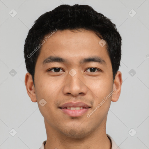 Joyful asian young-adult male with short  black hair and brown eyes