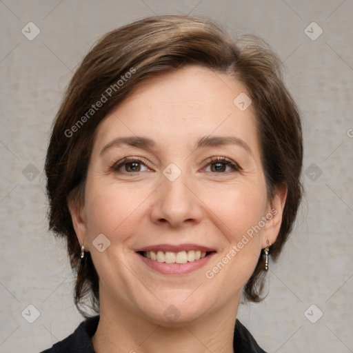 Joyful white adult female with medium  brown hair and grey eyes