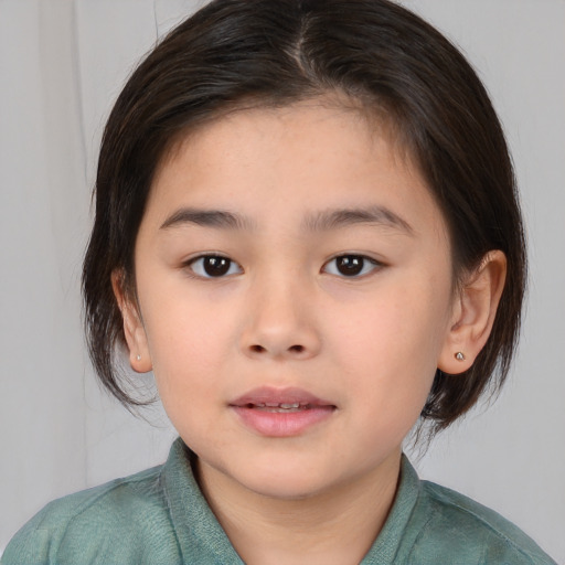 Joyful white child female with medium  brown hair and brown eyes