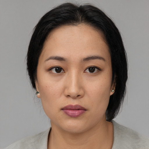 Neutral asian young-adult female with medium  black hair and brown eyes