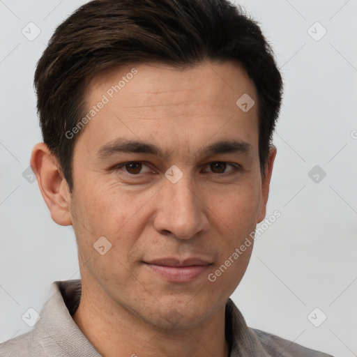 Joyful white adult male with short  brown hair and brown eyes