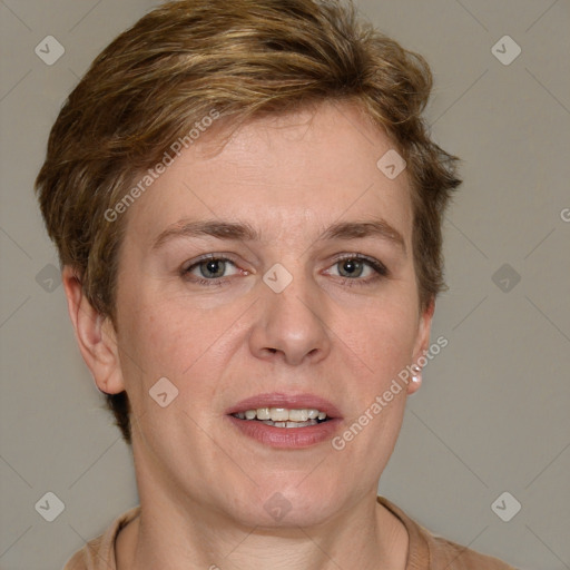 Joyful white adult female with short  brown hair and grey eyes