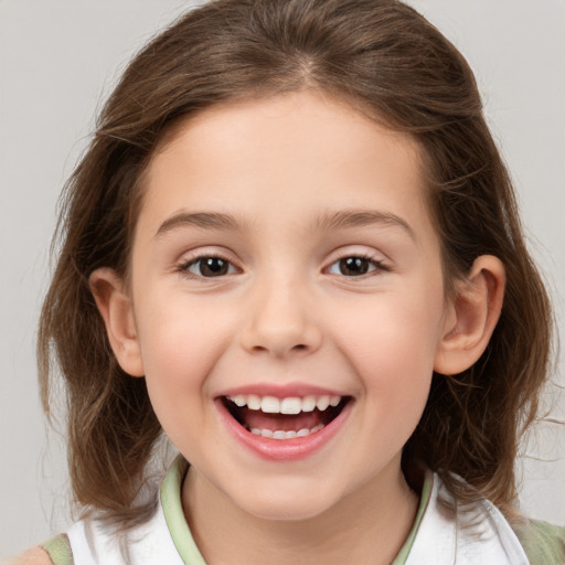 Joyful white child female with medium  brown hair and brown eyes