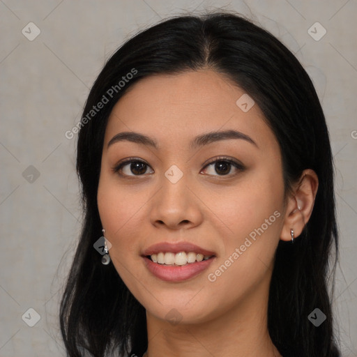 Joyful asian young-adult female with long  black hair and brown eyes