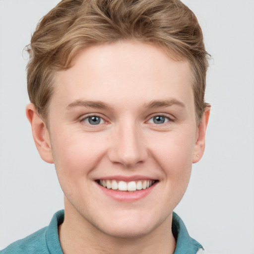 Joyful white young-adult female with short  brown hair and blue eyes