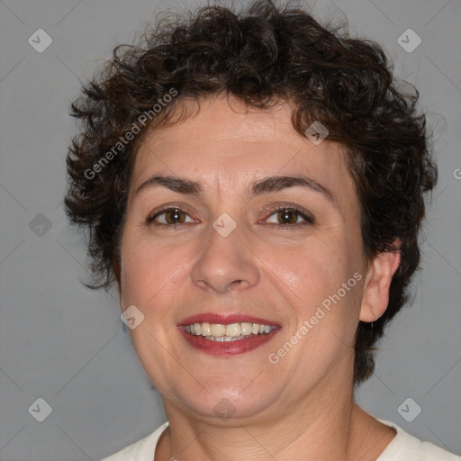 Joyful white adult female with short  brown hair and brown eyes