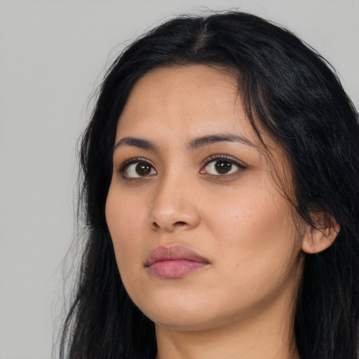 Neutral latino young-adult female with long  black hair and brown eyes
