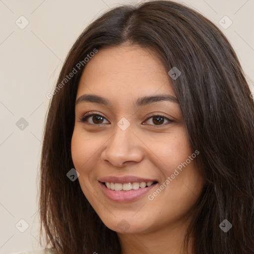 Joyful white young-adult female with long  brown hair and brown eyes