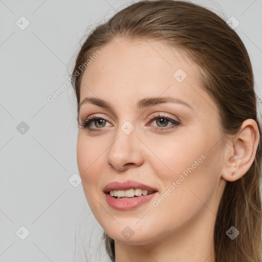 Joyful white young-adult female with long  brown hair and grey eyes