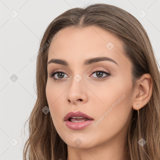 Neutral white young-adult female with long  brown hair and brown eyes