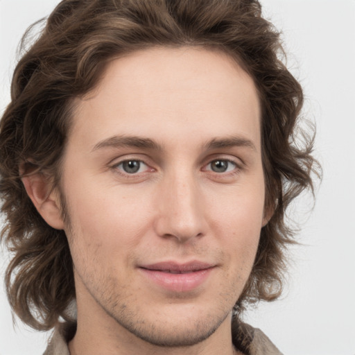 Joyful white young-adult male with medium  brown hair and brown eyes