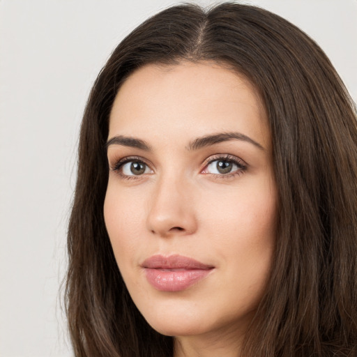 Neutral white young-adult female with long  brown hair and brown eyes