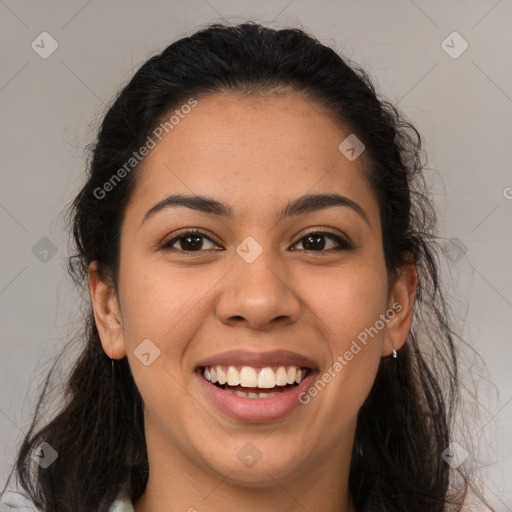 Joyful latino young-adult female with long  brown hair and brown eyes