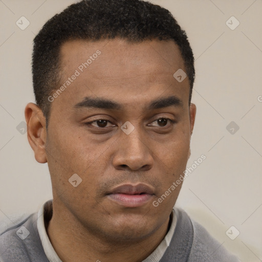 Neutral latino young-adult male with short  brown hair and brown eyes