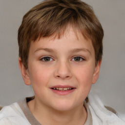 Joyful white child male with short  brown hair and brown eyes