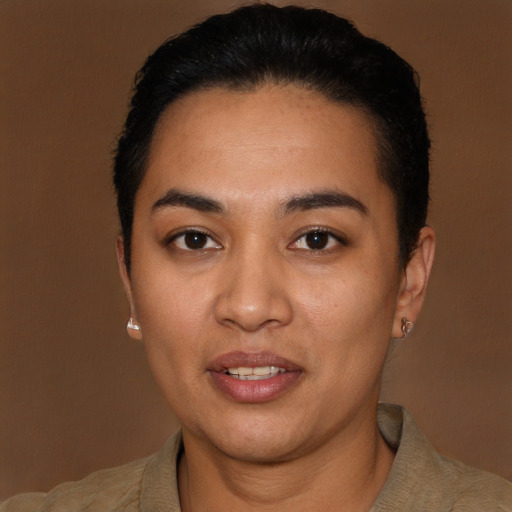 Joyful latino young-adult female with short  black hair and brown eyes