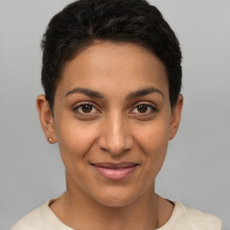 Joyful latino young-adult female with short  brown hair and brown eyes