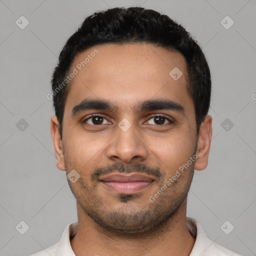 Joyful latino young-adult male with short  black hair and brown eyes