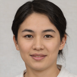 Joyful asian young-adult female with short  brown hair and brown eyes