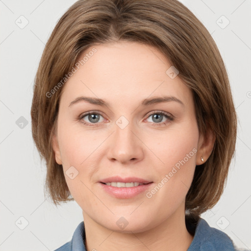 Joyful white young-adult female with medium  brown hair and grey eyes