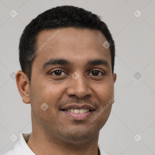 Joyful latino young-adult male with short  brown hair and brown eyes