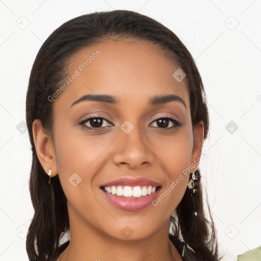 Joyful latino young-adult female with long  brown hair and brown eyes