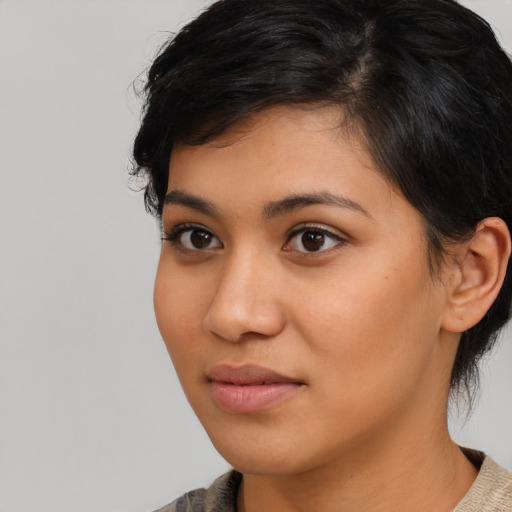 Neutral latino young-adult female with medium  brown hair and brown eyes