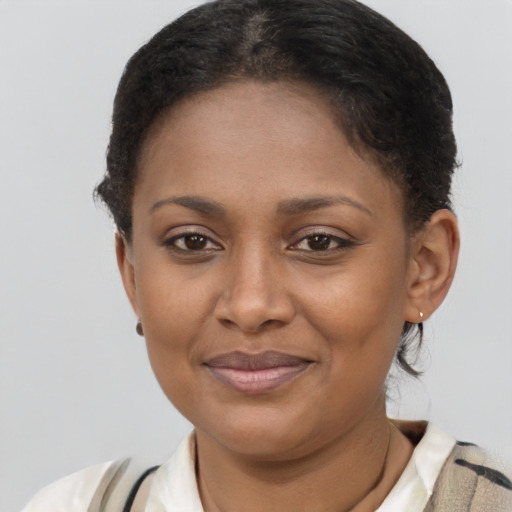 Joyful latino young-adult female with short  brown hair and brown eyes