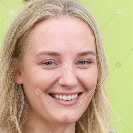 Joyful white young-adult female with long  brown hair and blue eyes